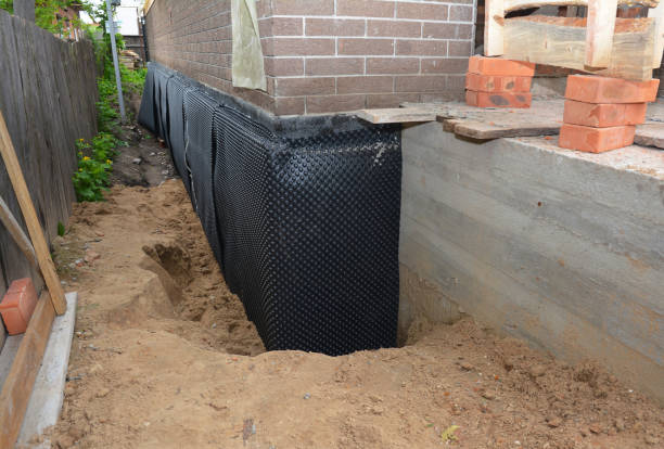 SJ Waterproofing Pros technician performing targeted Waterproofing assessment in Muncie, IN